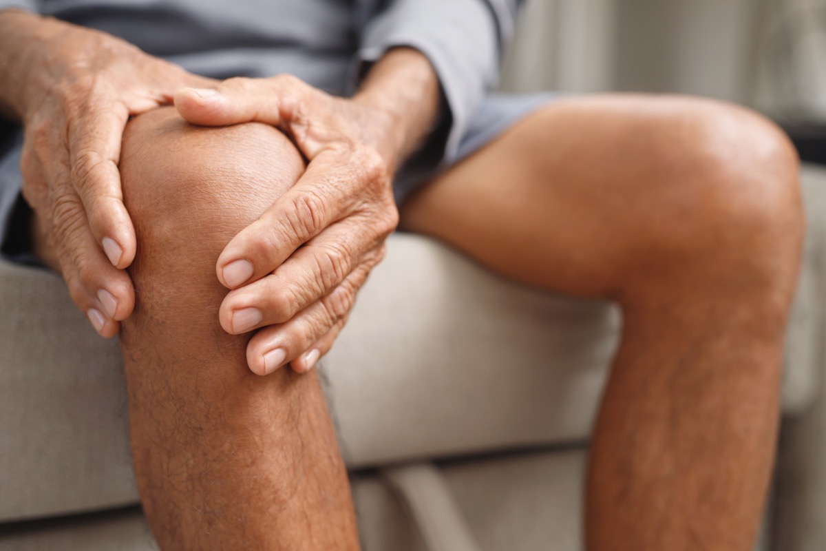 a man with swelling holding his knee